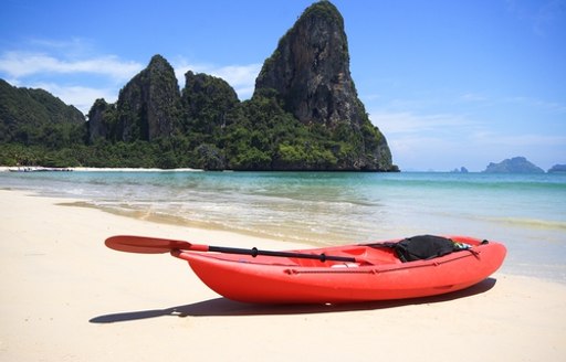 red boat shore in Thailand