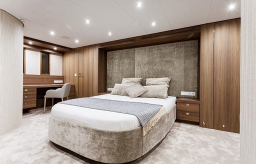 master suite with earthy hues on board charter yacht Timeless 