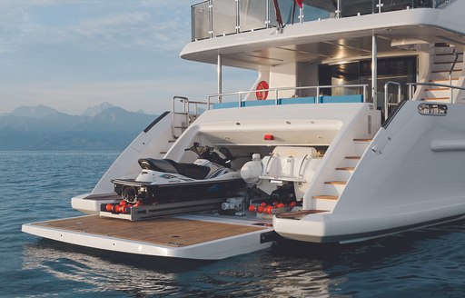 Jet-Skis being hoisted into tender garage on superyacht LULU