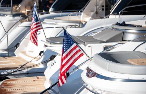Line of motor yacht swim platforms berthed 
