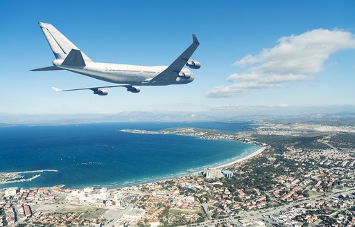 aeroplane flying over coastlines of greece