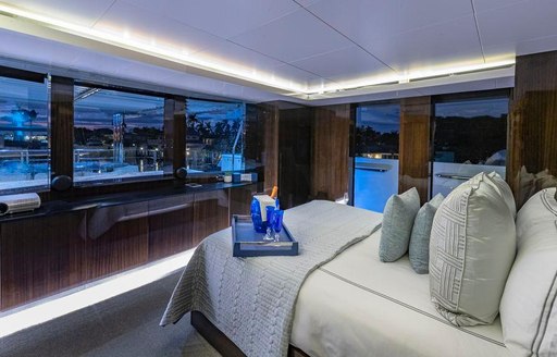 Cabin on superyacht OCULUS, looking out from bed to large windows