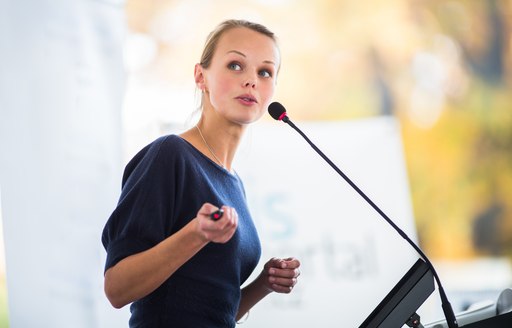 Woman gives lecture on topic in auditorium 