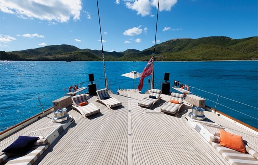 spacious aft deck during the day with sun loungers aboard luxury yacht TIARA 