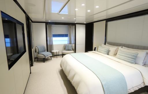 Double guest cabin with two armchairs onboard charter yacht ANDIAMO