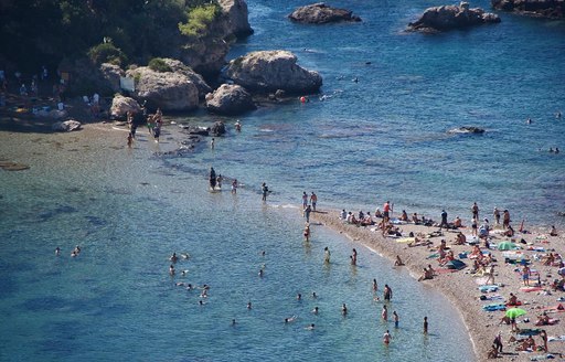 Sicily - Isola Bella isthmus people aerial view