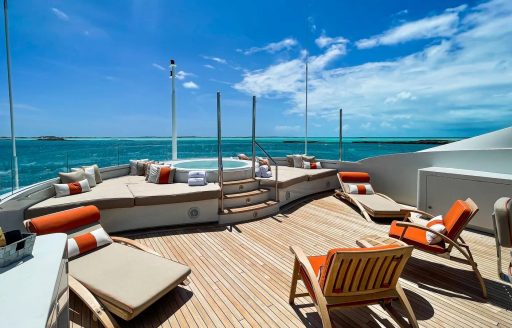 Charter yacht AVALON exterior deck space with loungers and Jacuzzi