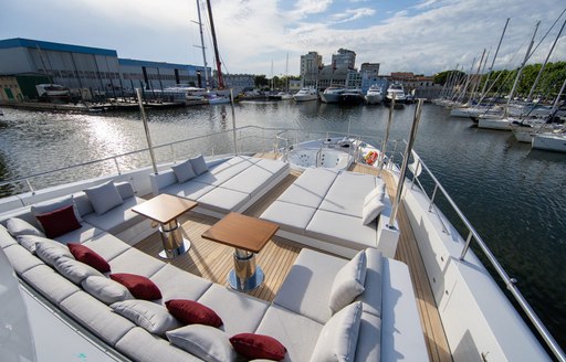 Overview of the foredeck lounge area and sun pads onboard charter yacht HAPPY ME