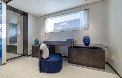Master cabin bureau and blue seat onboard charter yacht ACQUA CHIARA