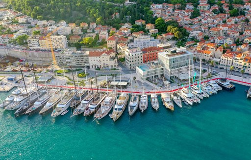Aerial view of  Zapadna obala with motor yacht charters berthed