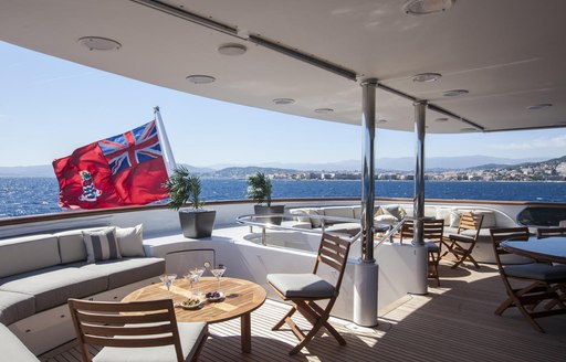 chairs and tables on the aft deck of charter yacht Lady Ellen II