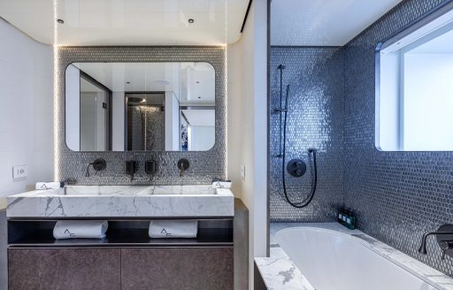 Ensuite with dual sink and bath onboard charter yacht ACQUA CHIARA