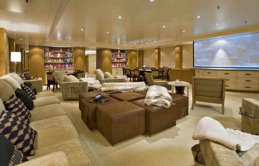 The brown and bronzed furnishings inside of a superyacht