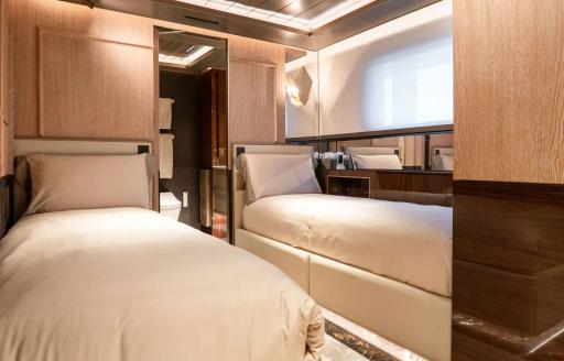 Twin cabin with two single berths onboard charter yacht RAJA² 