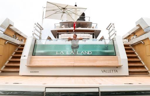 Charter yacht LA LA LAND deck Jacuzzi with nameplate
