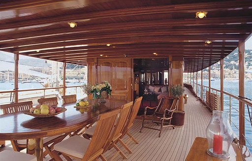 alfresco dining area on board classic charter yacht over the rainbow