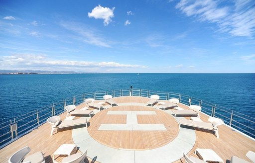 Helipad/sun lounging area on board superyacht NAIA