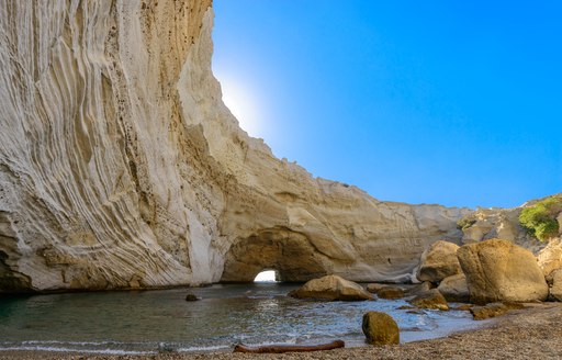 greece beach with cave in distance