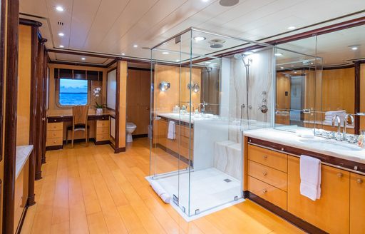 Overview of the master cabin ensuite onboard yacht rental NITA K II with a large sink unit and separate shower cubicle