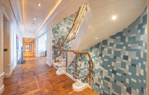 Interior corridor with blue tiling onboard charter yacht CARINTHIA VII
