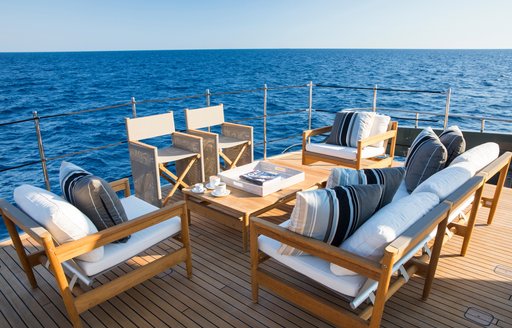 Exterior seating surrounded by sea views onboard charter yacht MOKA