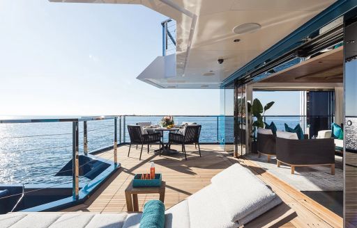 Exterior seating and sun lounger onboard charter yacht KING BENJI
