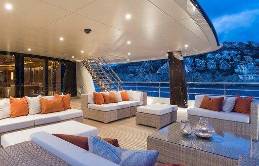 Al fresco dining and seating area on board luxury yacht Here Comes the Sun