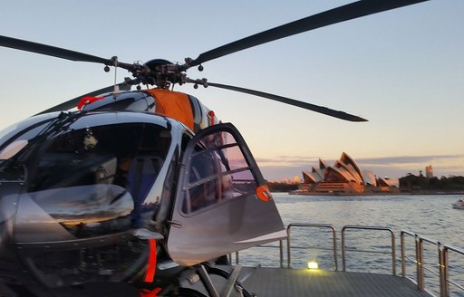 luxury yacht tango helicopter on helipad during charter