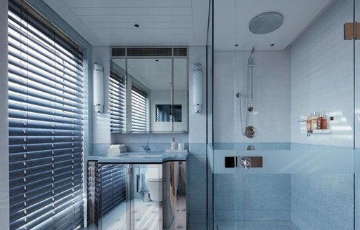 A blue bathroom on board Feadship superyacht JOY