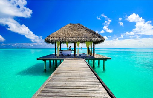 Massage at the end of a wooden pontoon in the Maldives