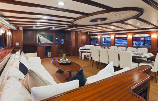 mahogany main salon of sailing yacht REGINA with dining and lounge areas