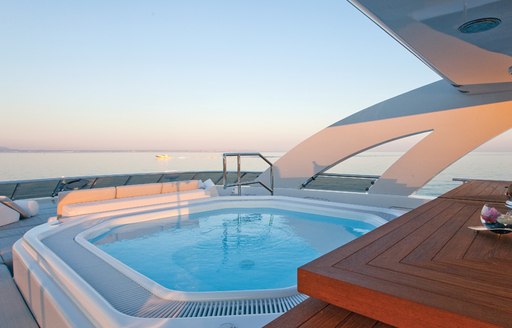 Jacuzzi on sundeck of motor yacht JEMS as sun goes down