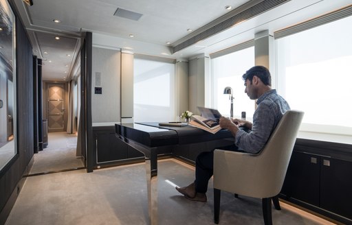 man sits in main office of irisha