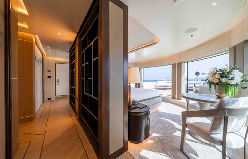 Charter yacht SYMMETRY interiors with seating and a book case