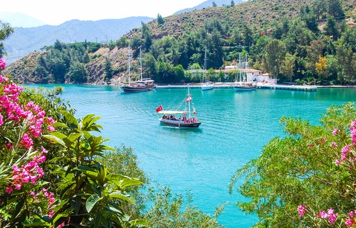 Gulet yachts anchored in a sheltered cove in Turkey