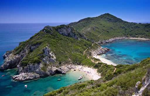 white beaches and green hilltops in Greece