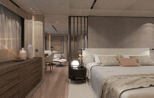 Master cabin rendering onboard charter yacht ANDIAMO with central berth and access to a seating area aft