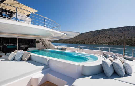 Swimming platform on superyacht O'PARI surrounded by sunpads