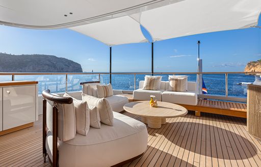 Exterior seating area onboard charter yacht LIV LOVE