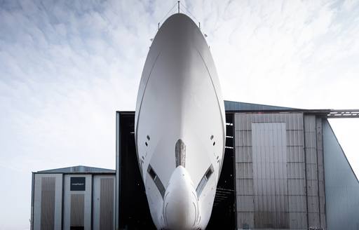 Ground-level view looking up at bow of superyacht LEVIATHAN