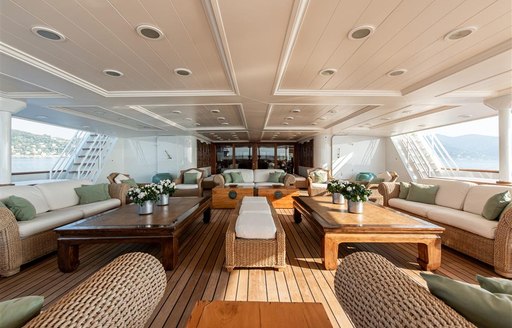 Covered dining areas on deck of superyacht Bleu De Nimes