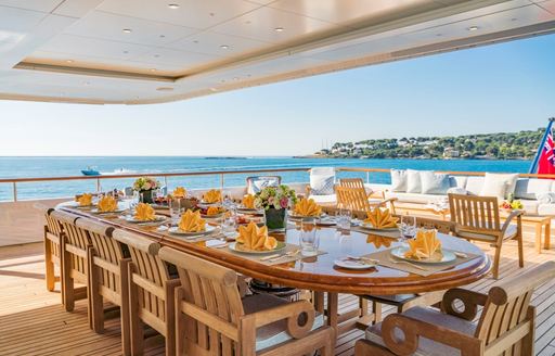 Alfresco dining area onboard charter yacht MOSAIQUE