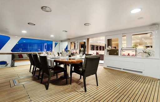 aft deck alfresco dining arrangement on board charter yacht