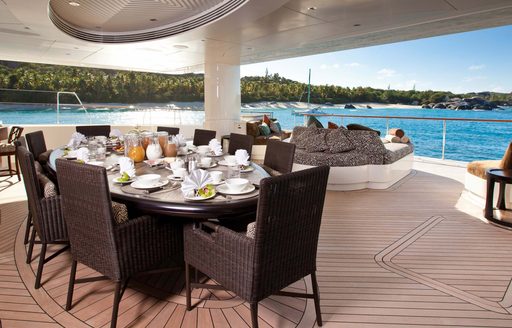 Alfresco dining table and chairs onboard charter yacht HEMISPHERE
