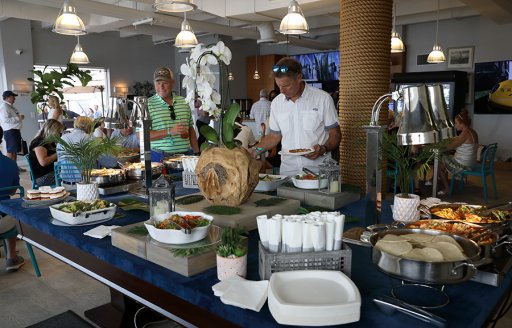 Windward VIP buffet at FLIBS with visitors helping themselves at the counter