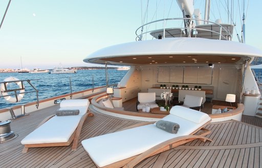 chic deck areas with chaise loungers and lounge on board luxury yacht SILENCIO