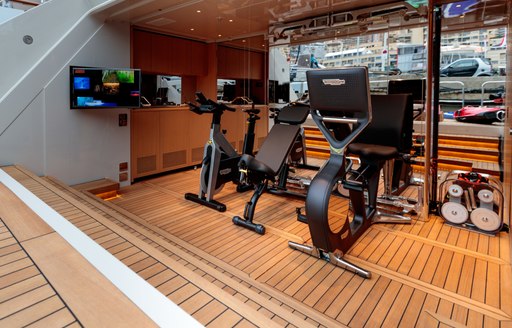 gym equipment on the beach club of charter yacht VERTIGE