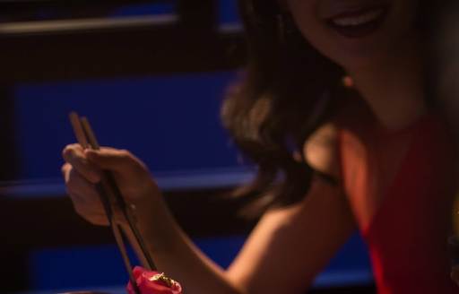 Female charter guest eating sushi