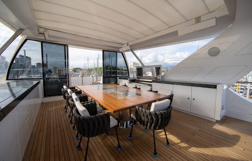 alfresco dining area on sundeck of luxury yacht happy me