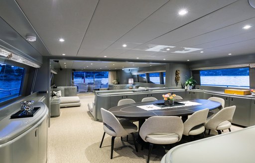 Dining area with table on Mondo Marine motor yacht TALILA